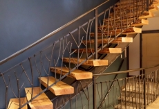 Stairs with custom metal rainling and treads